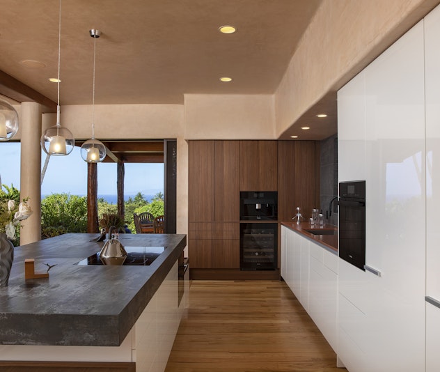 Old world plaster walls with a sleek modern Poggenpohl kitchen