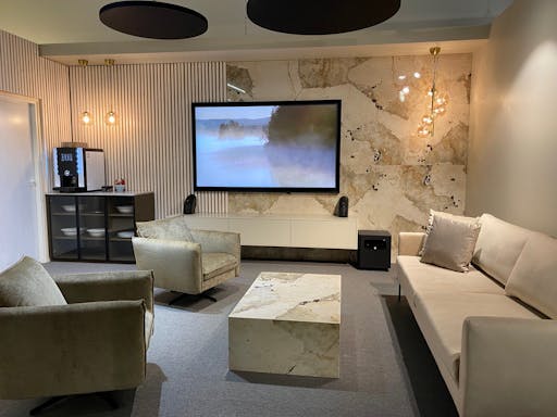 Image of dekton khalo lounge space walling and table cube in Gallery - Cosentino