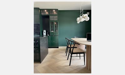 Charming kitchen in dark green and Silestone Corktown as worktops